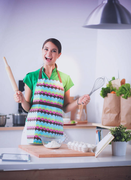 Woman is making cakes in the kitchen - Φωτογραφία, εικόνα
