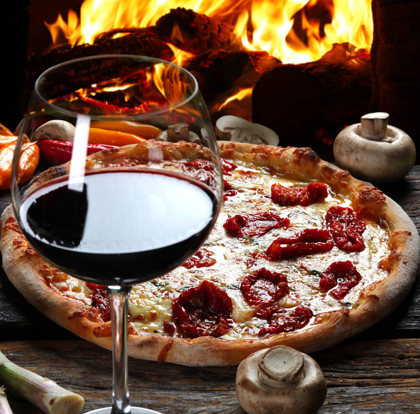 Delicious pizza in the wood-fired oven - Foto, Bild