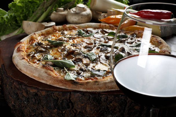 Delicious pizza in the wood-fired oven - Photo, image