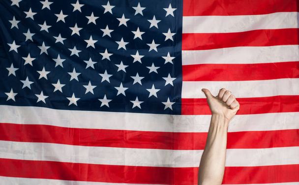thumbs up on the background of the American flag - Φωτογραφία, εικόνα