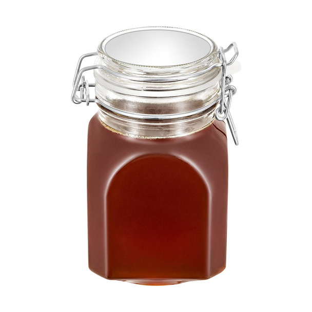 Zoete honing in glazen pot, op witte achtergrond - Foto, afbeelding