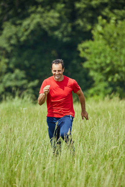 Man running on trail  - Valokuva, kuva