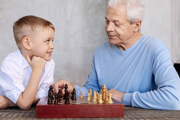 Charming nice grandpa teaching his grandson - Foto, immagini