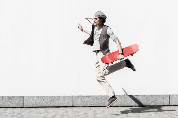 Active teenager is spending time on street dynamically - Fotografie, Obrázek