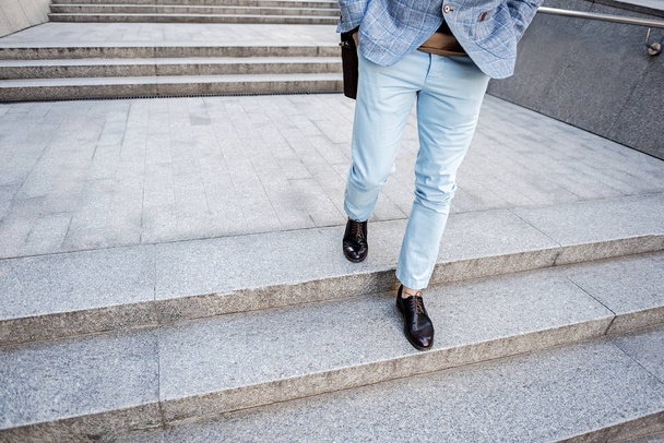 Busy stylish male person walking - Fotó, kép