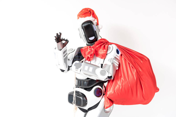 Vrolijke robot is het dragen van Santa Claus GLB - Foto, afbeelding