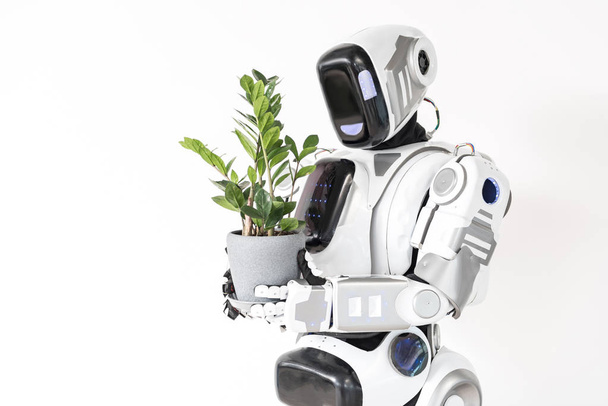 Modern cyborg is growing houseplant - Photo, Image