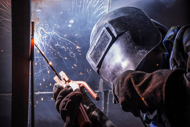 Arc welding of a steel in construction site - Фото, изображение