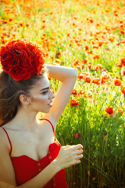 woman or girl in field of poppy seed - Φωτογραφία, εικόνα