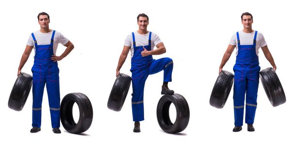 Handsome tyre repairman isolated on white - Fotó, kép