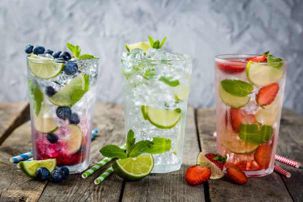 Selection of colorful mojitoes in glasses - Foto, afbeelding