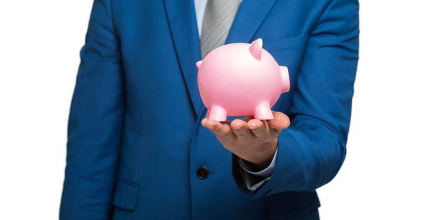 businessman holding piggy bank  - Foto, afbeelding