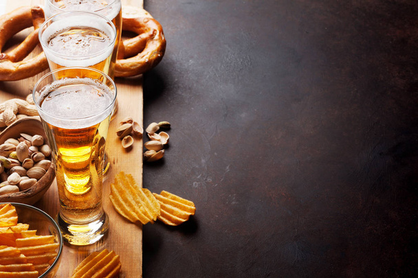 beer, nuts, chips and pretzels - Photo, Image