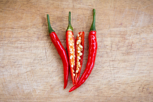 red hot chili peppers on the wooden background - Photo, Image