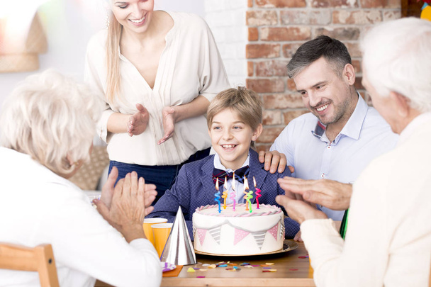 Family clapping their hands at a party - Foto, imagen