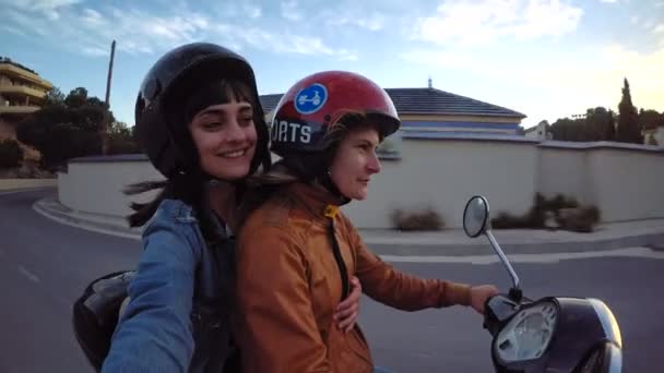 Two friends or lovers ride vintage scooter - Кадри, відео