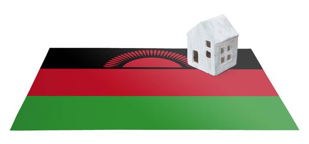 Pequeña casa en una bandera - Malawi
 - Foto, Imagen