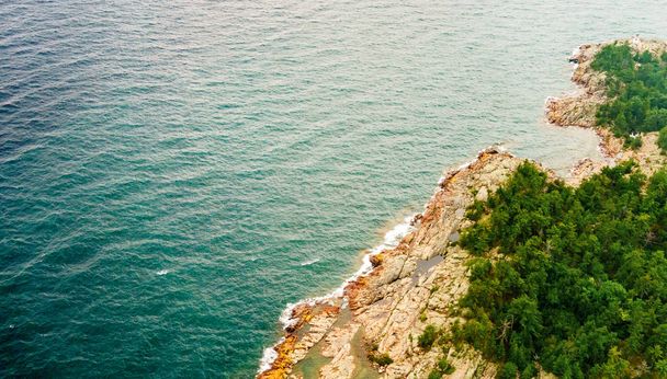 High angle view of coastline with offshore rocks - Photo, Image