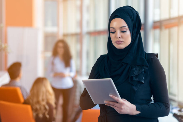beautiful Arabian girl with tablet computer working at startup office - Foto, immagini