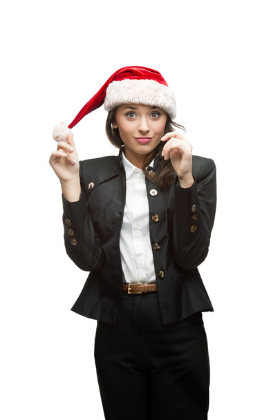Young cheerful businesswoman in santa hat on white - Foto, Bild