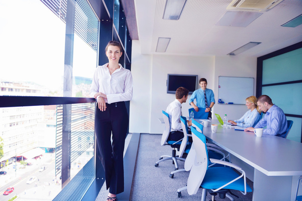 business woman with her staff in background at office - Foto, Imagem