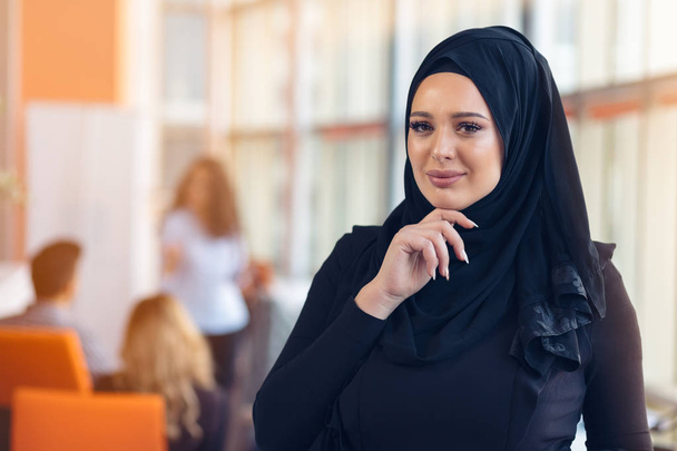 Attractive portrait of young muslim woman with black hijab at the office - Φωτογραφία, εικόνα