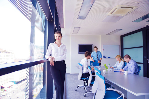 business woman with her staff in background at office - Foto, immagini