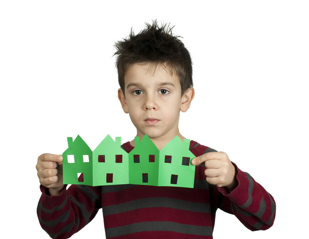 Little boy holding houses made of paper - Zdjęcie, obraz