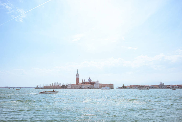 San Giorgio island in Venice, Piazza San Marco. View from Grand Canal. Scenic cityscape with gondolas - Fotografie, Obrázek