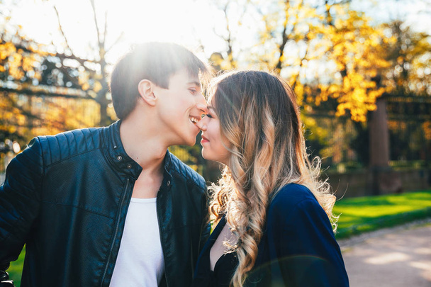 Close up portrait of boyfriend kissing girl on nose outdoors. - Fotografie, Obrázek