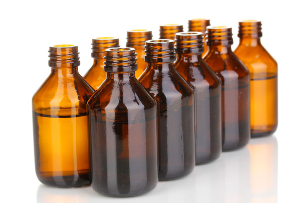 Medical bottles in the row isolated on white - Foto, Bild