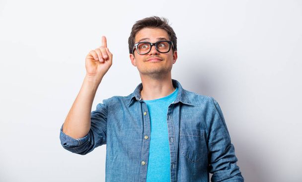 Young man in glasses and shirt have abstract idea - Photo, Image