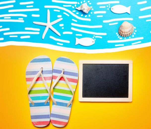 Summertime flip-flops and copy space board  - Photo, Image