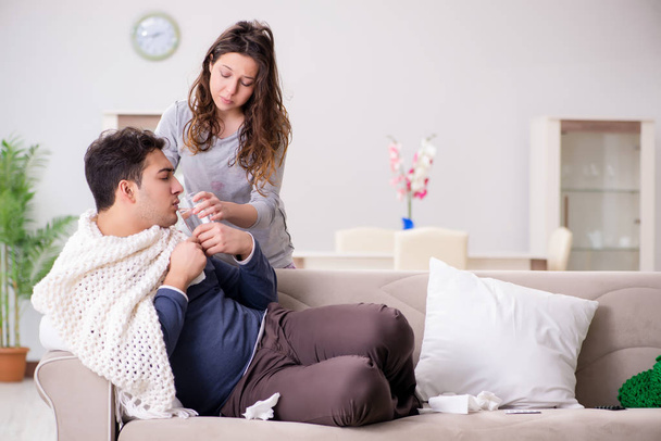 Wife caring for sick husband at home - Valokuva, kuva