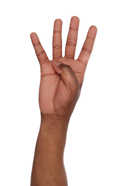 Black hand pokazuje numer cztery na białym tle - Zdjęcie, obraz