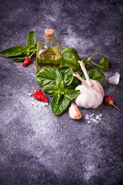 Fresh green basil with garlic and olive oil - Photo, Image