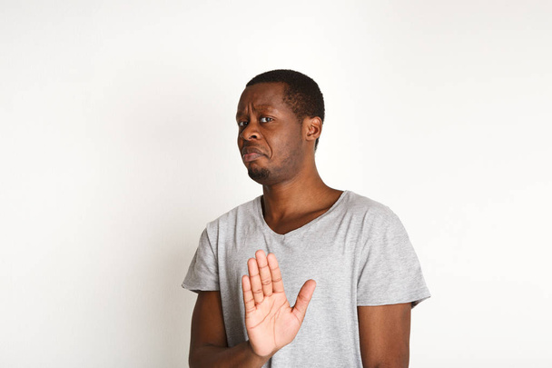 Negative human emotion, black man expressing protest - Fotó, kép