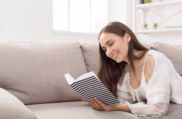 Beautiful woman reading a book - Фото, изображение
