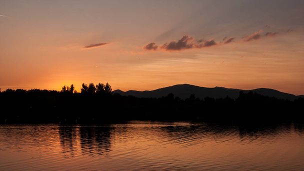 sunset on lake landscape with reflection  - Φωτογραφία, εικόνα