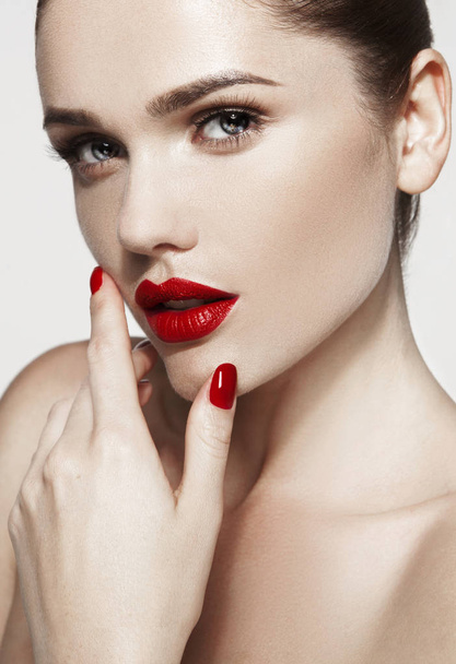 Beautiful young model with red lips - 写真・画像