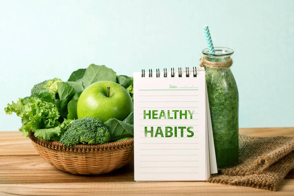 the HEALTHY HABITS message and the Healthy fresh  green smoothie - Photo, Image