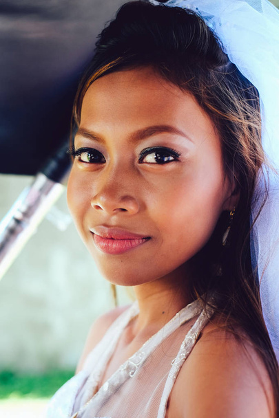 Portrait of a young beautiful Asian bride on her wedding day - Fotoğraf, Görsel