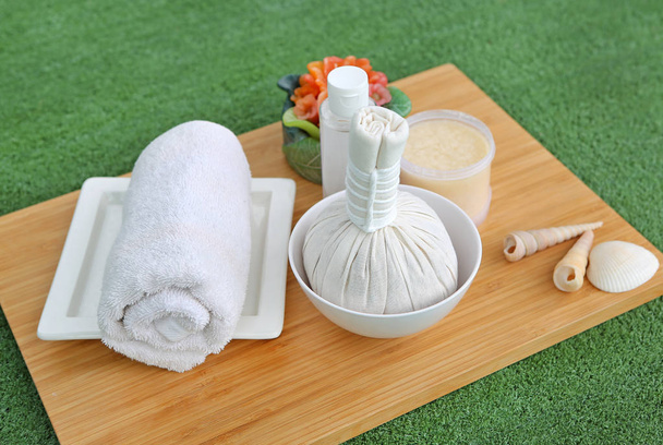 Spa herbal compressing ball with towels and Salt Scrub, Spa concept background - Photo, image