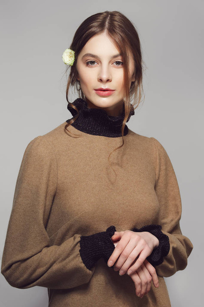 Portrait of a young cute woman in warm wool sweater. Clean prett - Фото, изображение