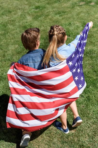 siblings with american flag - Fotó, kép