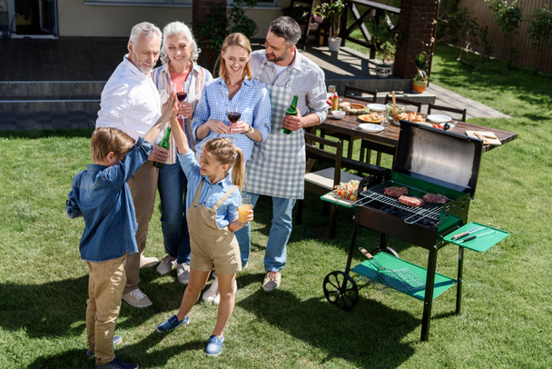 family having barbecue together - Foto, Imagen