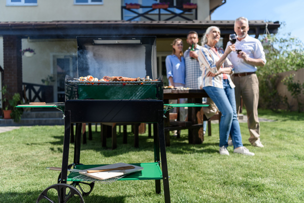 family spend time together at barbecue  - Φωτογραφία, εικόνα