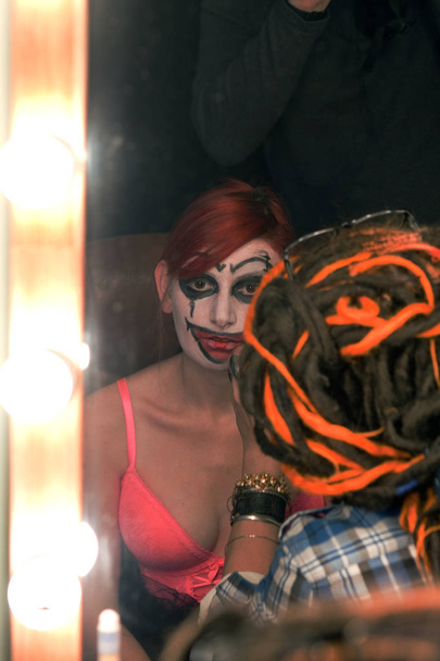 actress put on makeup clown in front dressing room mirror - Photo, image