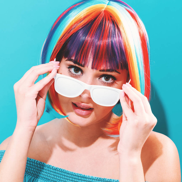 Beautiful woman in a colorful wig - Photo, Image