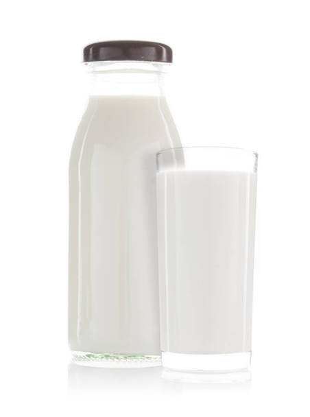 a cup of milk and bottle of milk isolated - Φωτογραφία, εικόνα